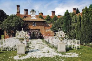 Dovecote ceremony Woodhall Manor petals outdoor aisle
