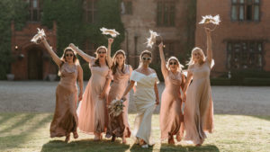 Bridal party celebrating Woodhall Manor